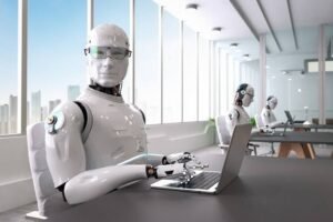 a group of robots working on a laptop