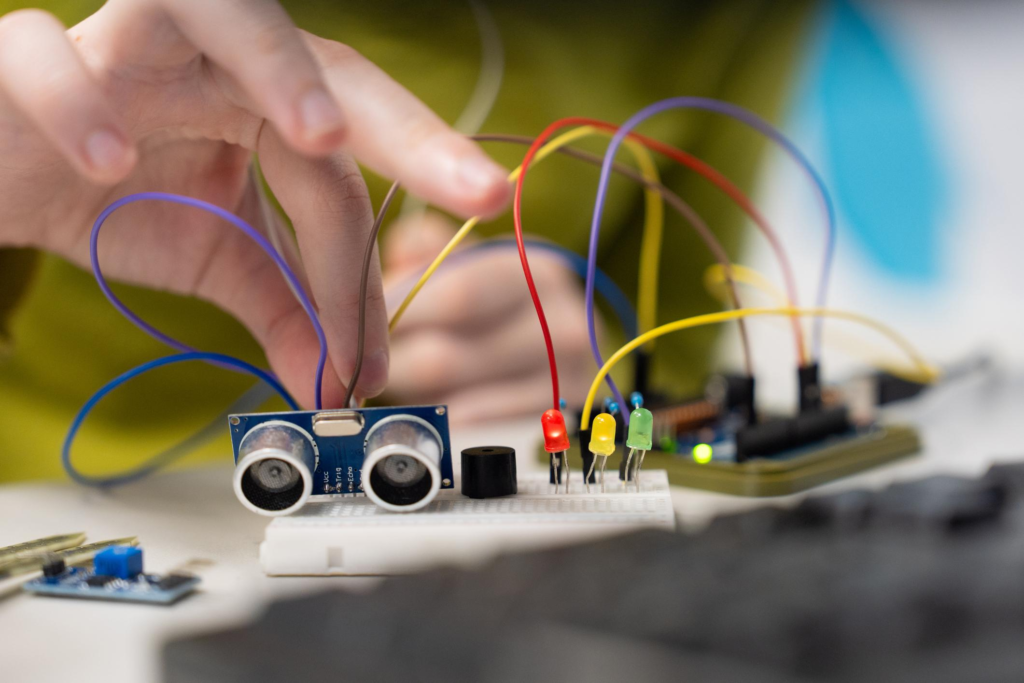 ESP32 Smart Monitoring System components including sensor module and breadboard